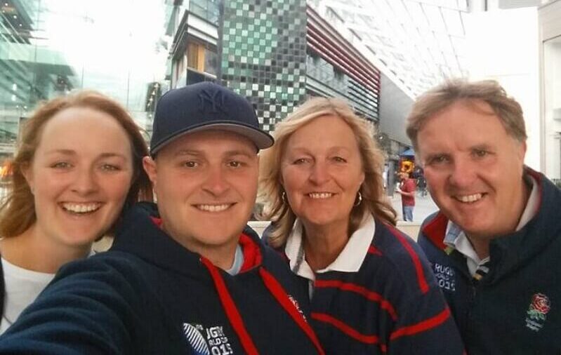 Bradley with his sister. mum and dad in front of westfield shopping centre