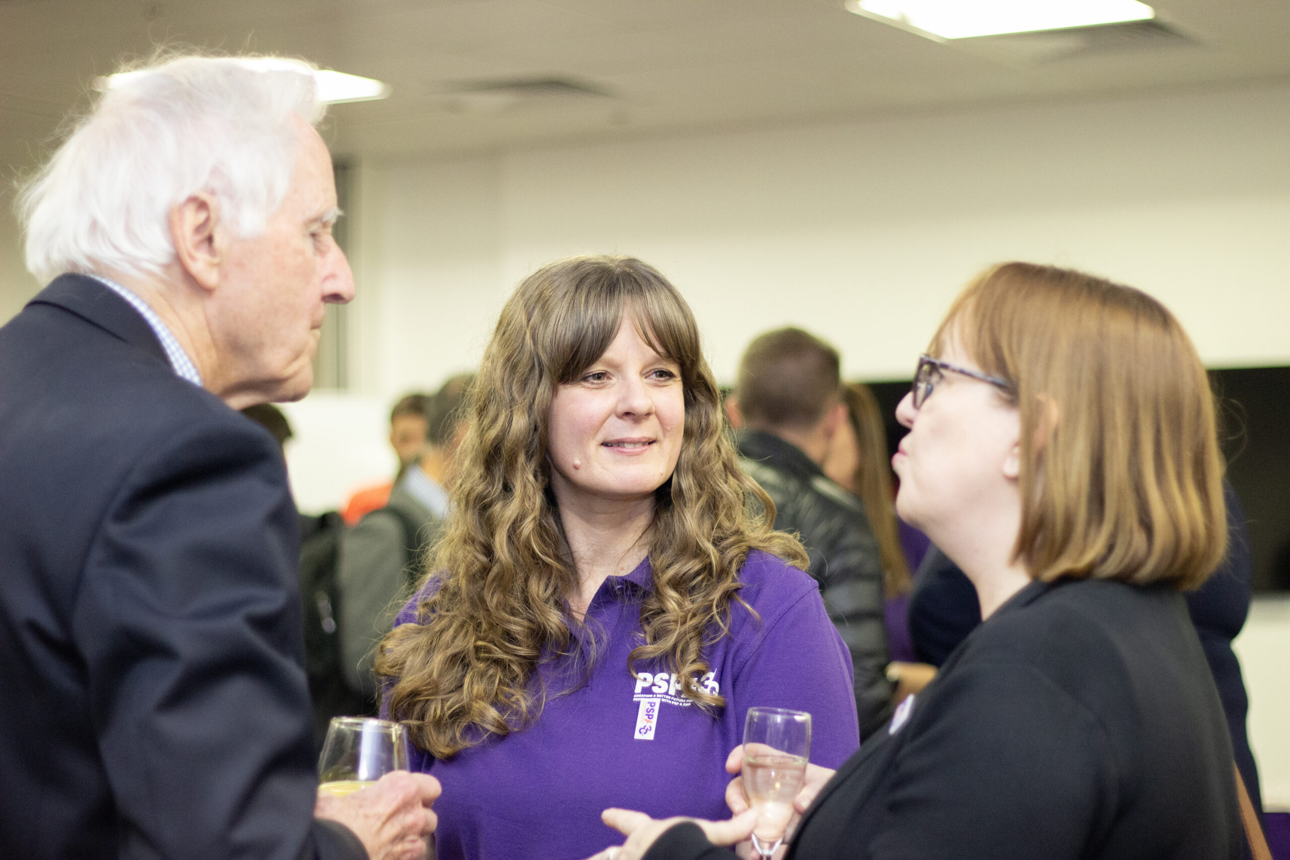 Claire Ayling listening to a couple chat