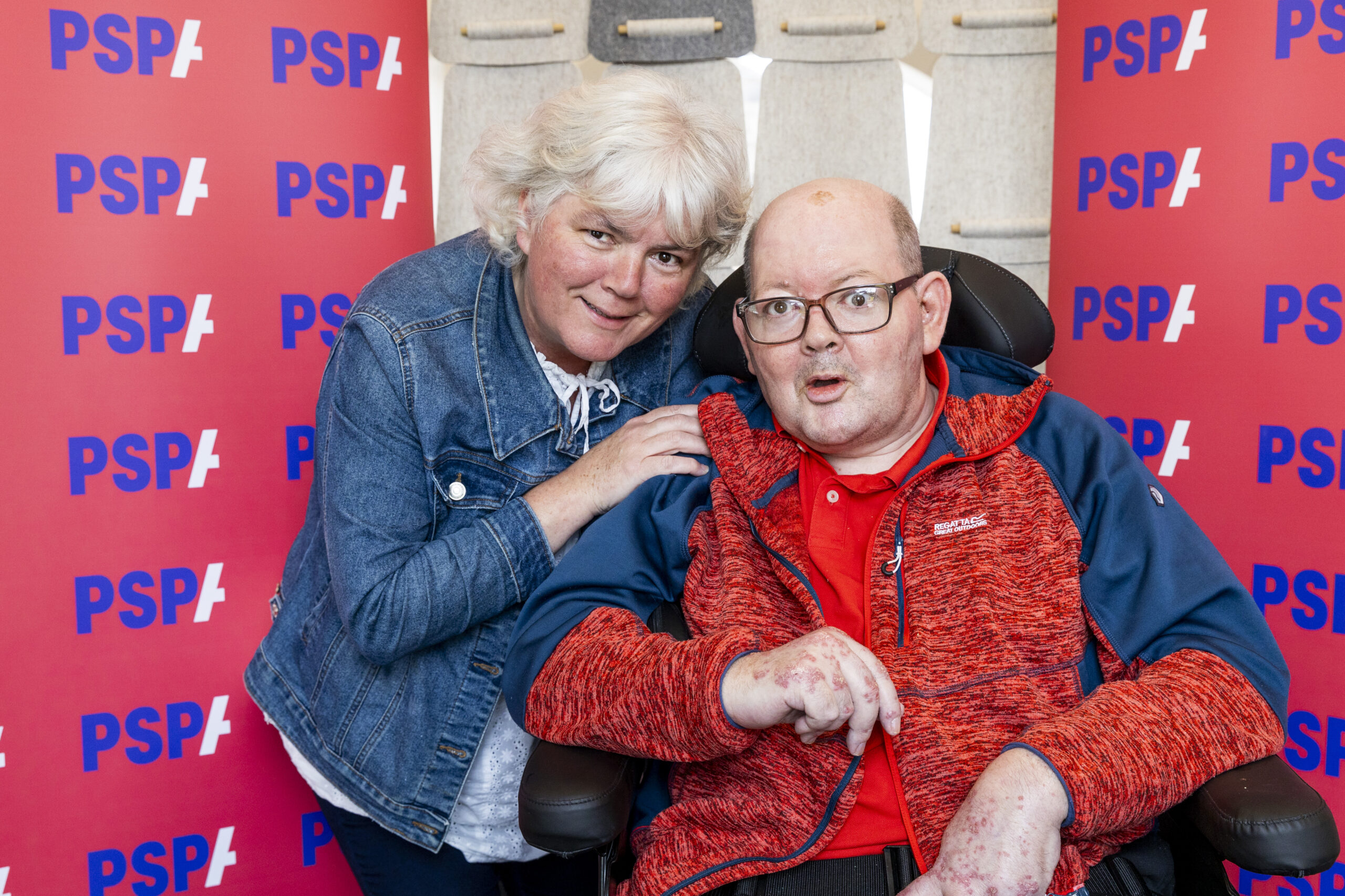 Kathleen Chappell standing with her Brother Stephen who is sitting in a wheelchair