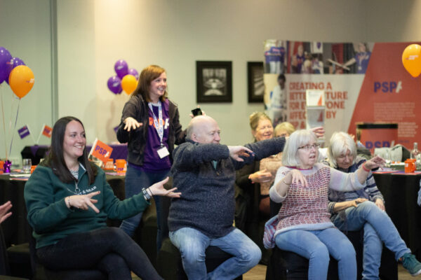 People taking part in the seated dance workshop at the Leeds Family and Friends Day