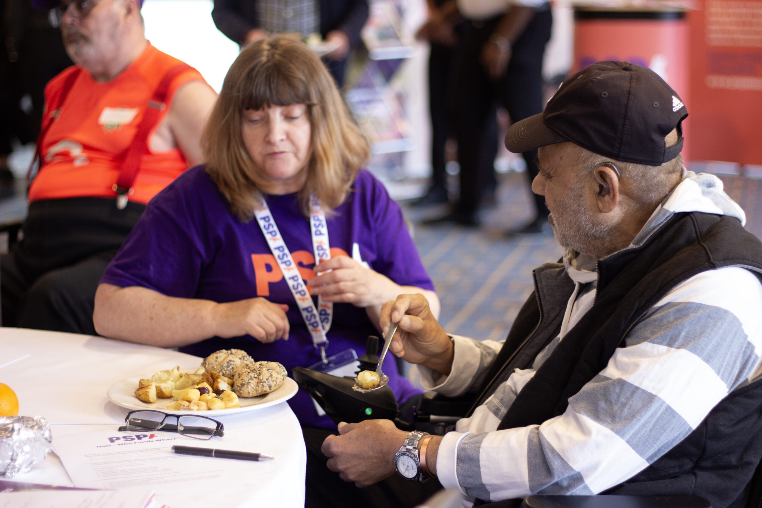Cathy speaking to a gentleman at the Family and Friends Day in Windsor