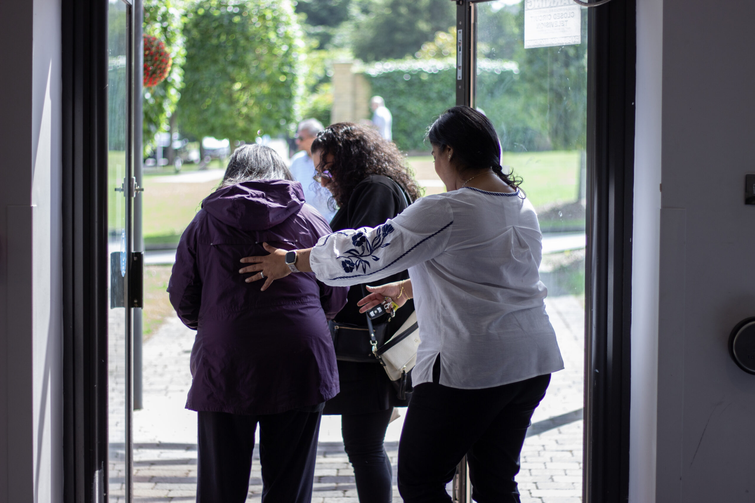 A family assisting their mum as they leave the Family and Friends Day in Windsor