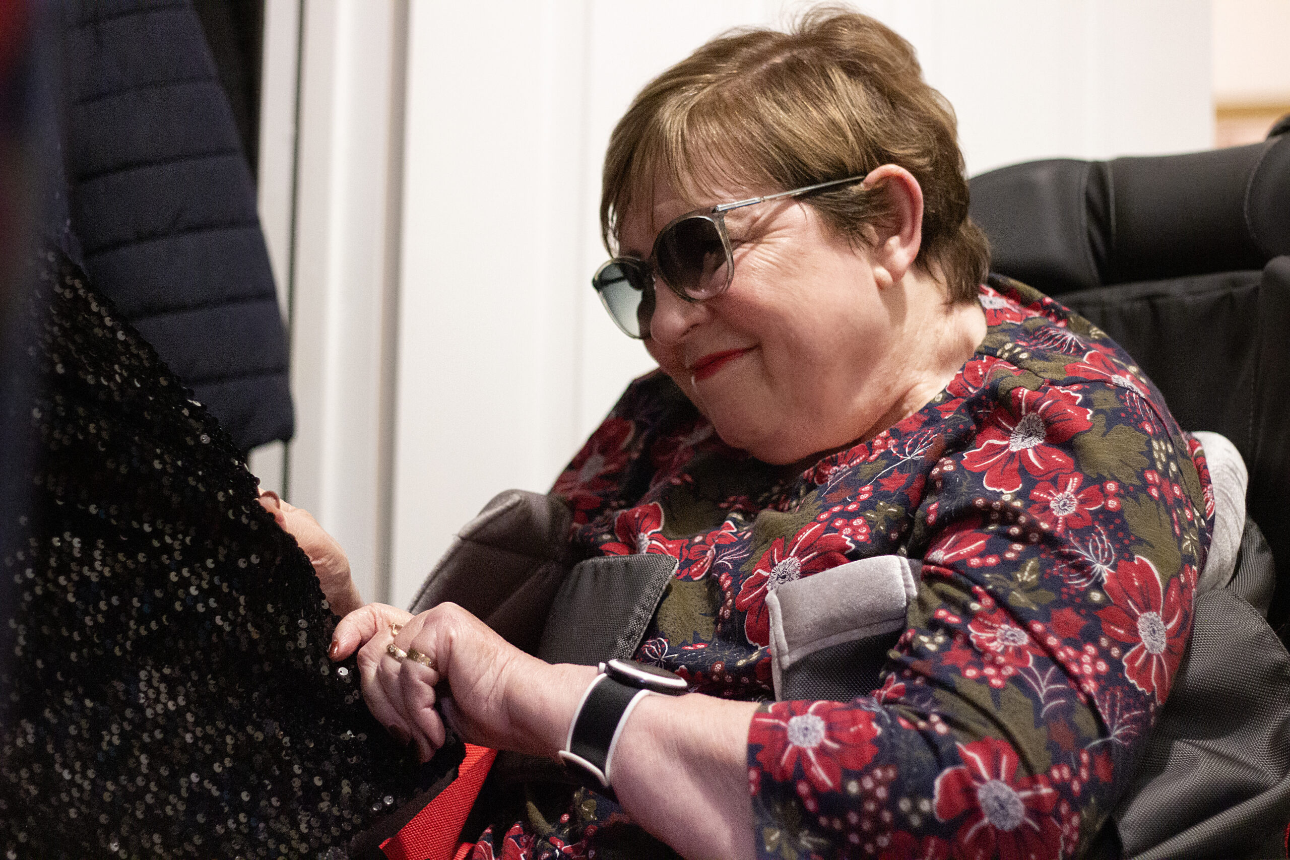 Lorna choosing clothes from her wardrobe
