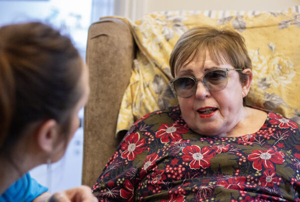 Lorna talking to her carer